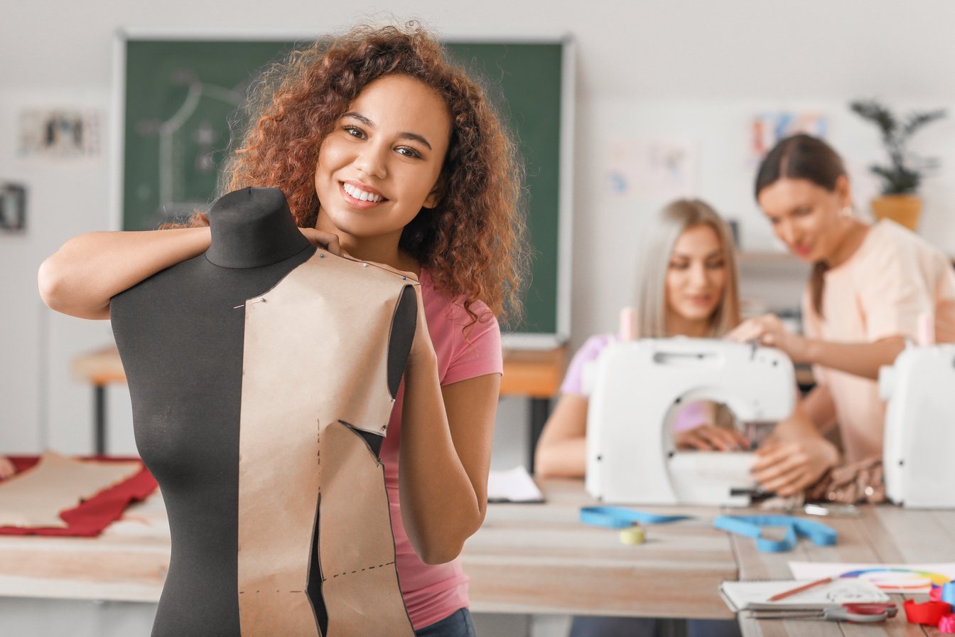 Woman with Mannequin in Sewing Class